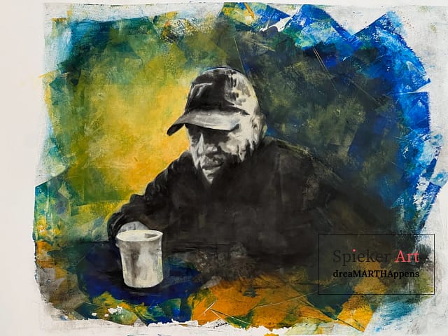 man in a baseball hat looking tired drinking a cup of coffee